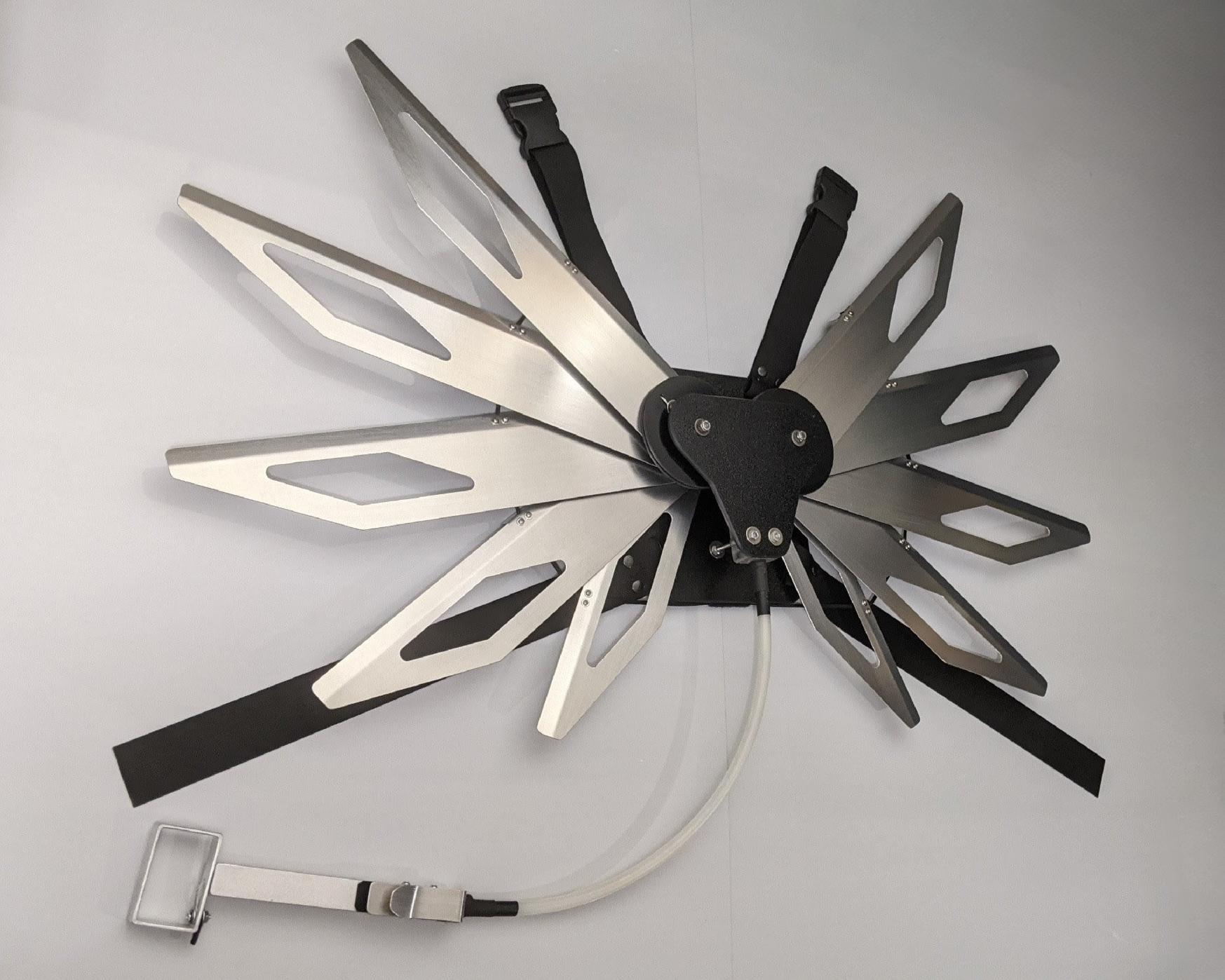 Costume black and silver metal mechanical wings that open and close with a pull cord